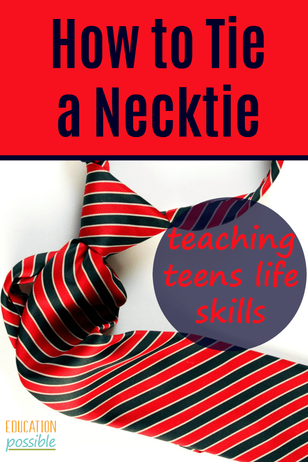 red and blue striped necktie tied, sitting on white surface