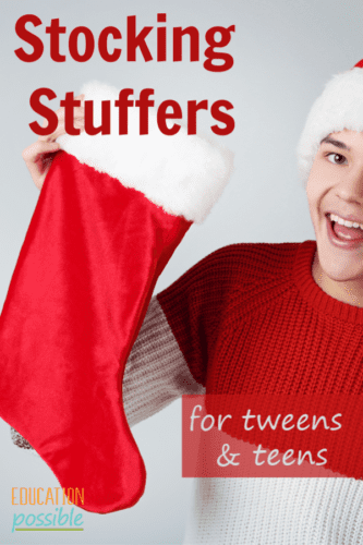 Teen boy holding red Christmas stocking with white fur trim. Text overlay says Stocking Stuffers for tweens & teens.