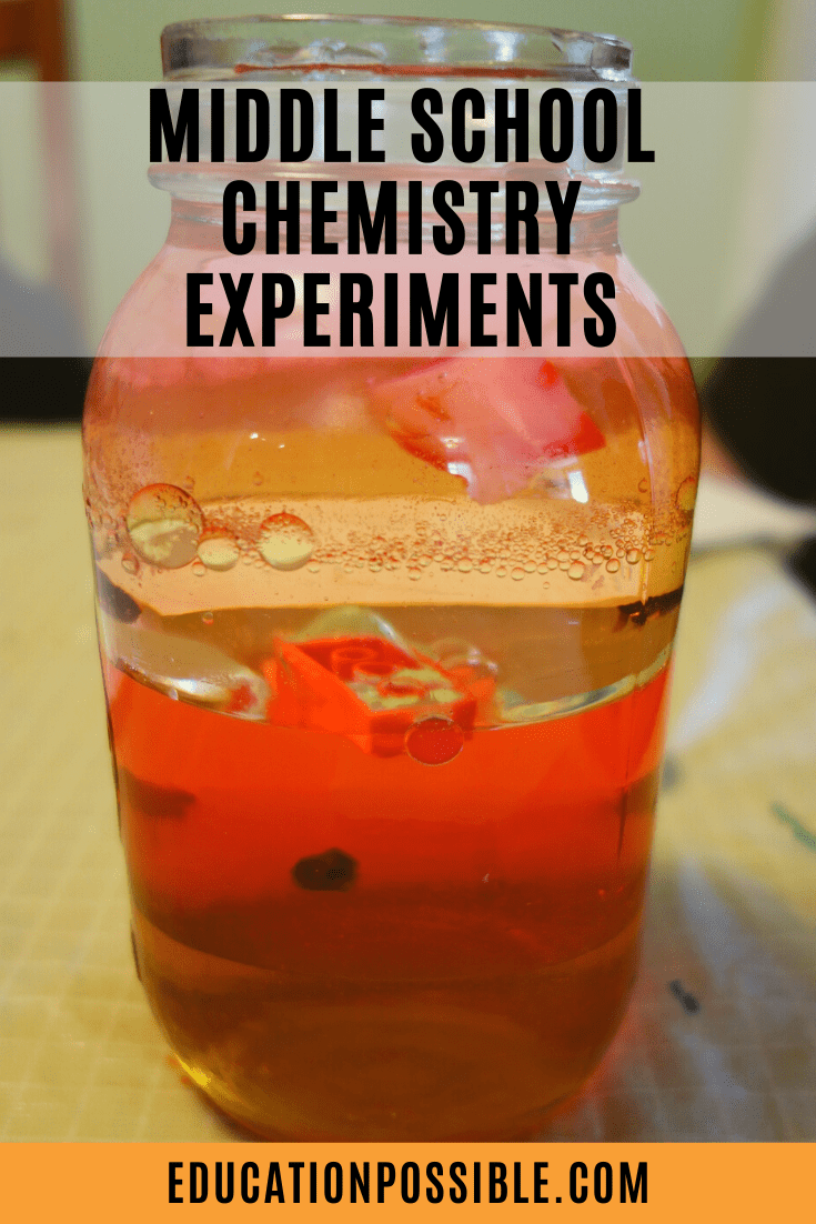Close up of layers of liquids in a large glass jar, random items floating inside the density jar experiment, Black text overlay reads Middle School Chemistry Experiments