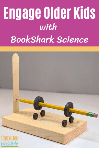 Teen's science experiment - a levitating pencil. There are 6 magnets used to make the yellow pencil levitate above a wood block. A purple rectangle is above the image with white text reading Engage Older Kids with BookShark Science.