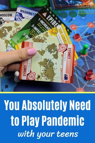 Close up of teen girl holding five cards from the Pandemic board game in her hand over the gameboard.