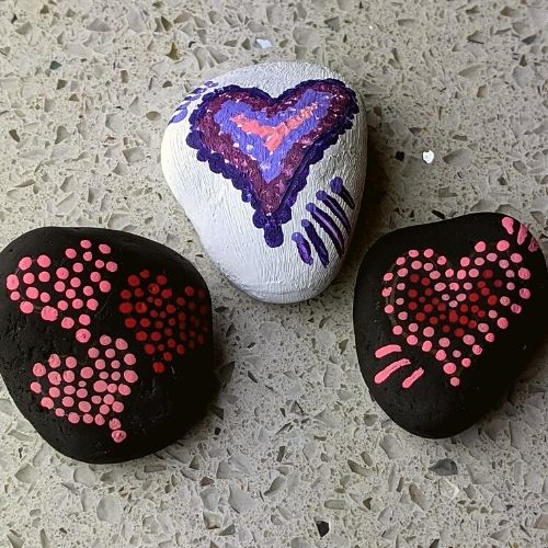 Painted rocks - 3 dotted hearts in pink, red, and purple