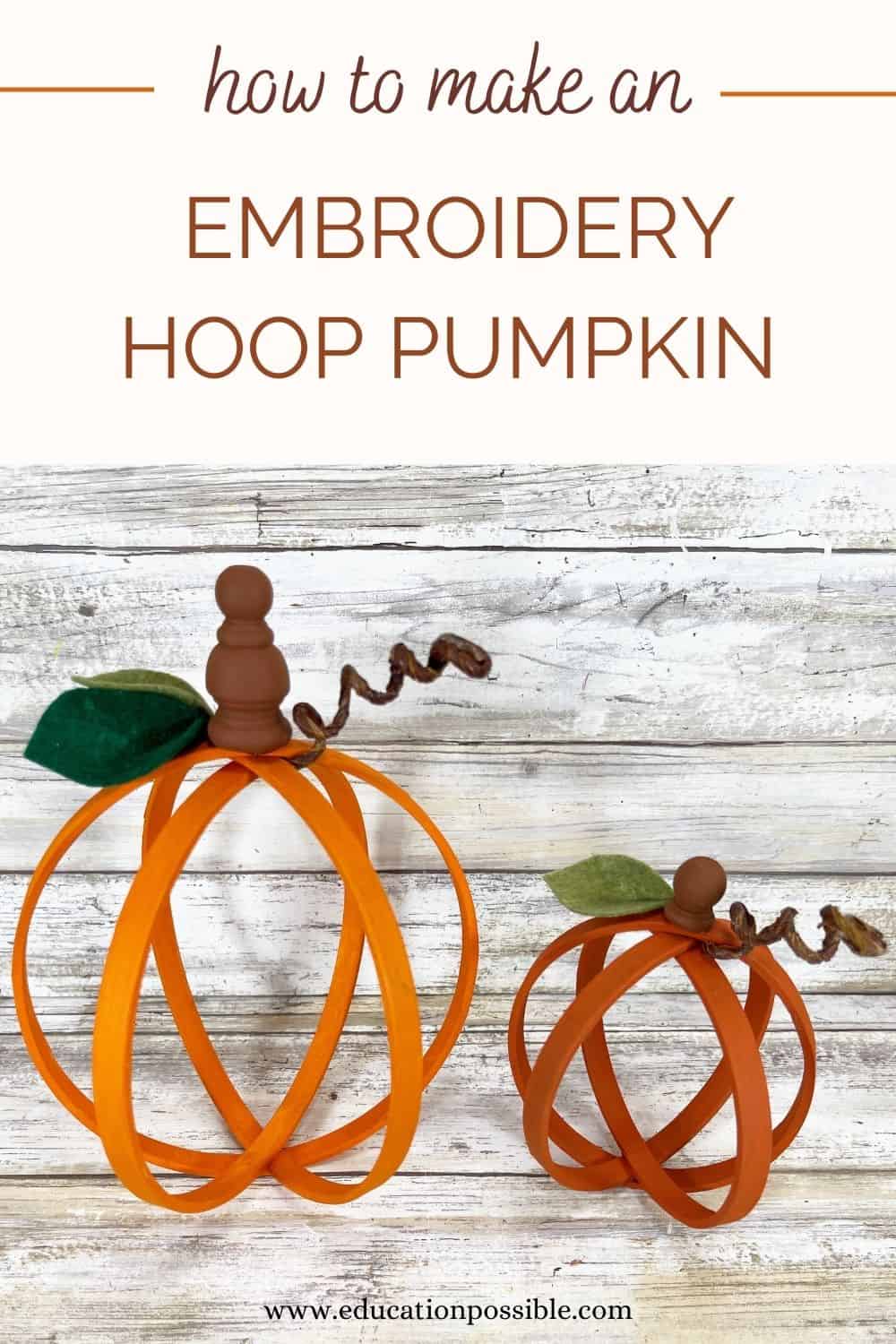 Two pumpkin decorations made out of embroidery hoops