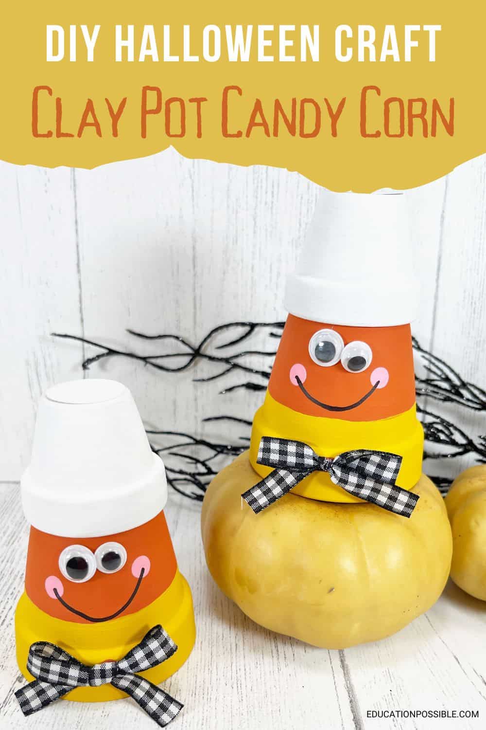 2 Halloween crafts - clay pots painted like candy corn with googly eyes