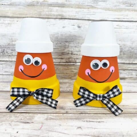 Clay pots turned into candy corn in this DIY craft