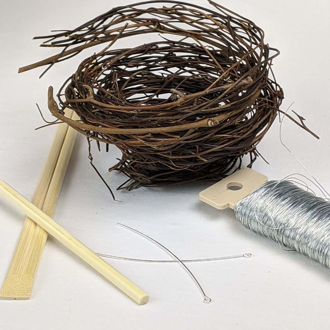 Craft supplies - chopsticks, twig wreath, silver wire, and eye pins