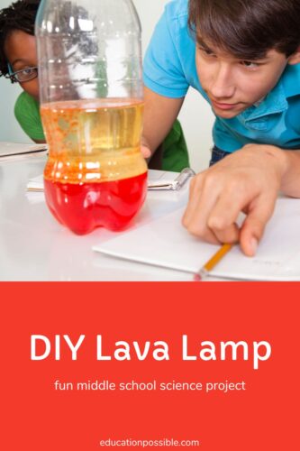 Teen boys looking at a clear soda bottle with red liquid and vegetable oil inside - a DIY lava lamp.