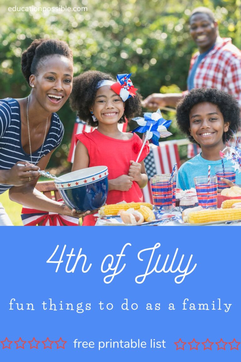 African American family - mom, dad, 2 kids - in backyard celebrating the 4th of July.